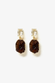 Amber Fragment Drop Earrings by Min & Lith featuring clear rectangular faceted studs and textured, deep amber-brown oval drops.