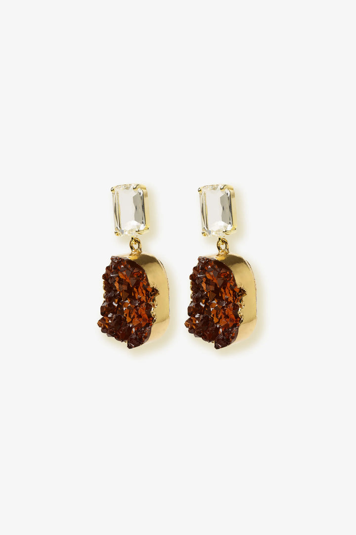 Amber Fragment Drop Earrings by Min & Lith featuring clear rectangular faceted studs and textured, deep amber-brown oval drops.