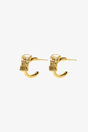 crust form hoop earrings with textured raw surface and gold hoop design