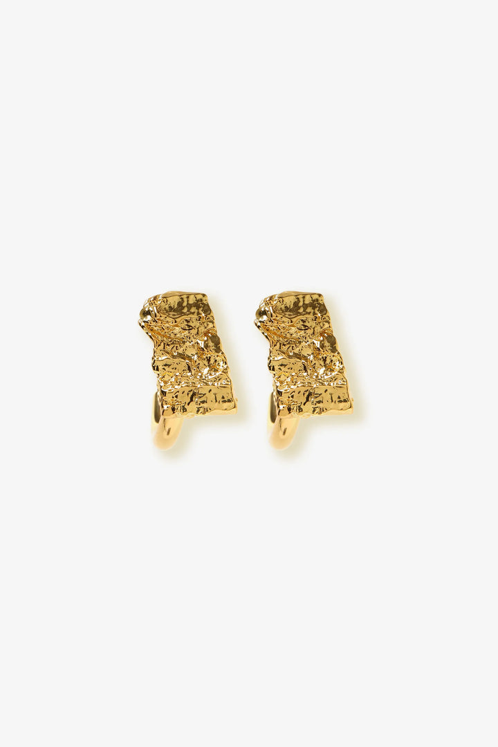 crust form hoop earrings with textured raw surface and gold hoop design