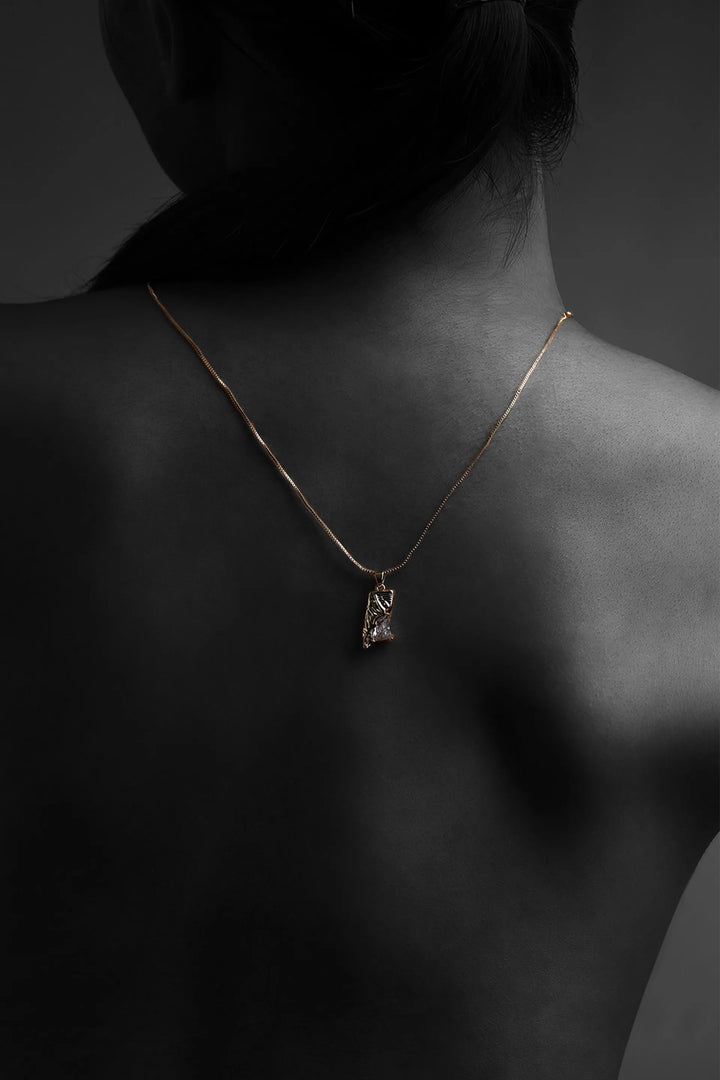 Crystal fragment pendant necklace with textured gold finish on fine chain