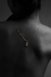 Crystal fragment pendant necklace with textured gold finish on fine chain