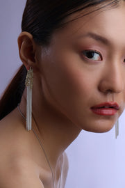 Molten cascade drop earrings with textured gold top and long chain tassels