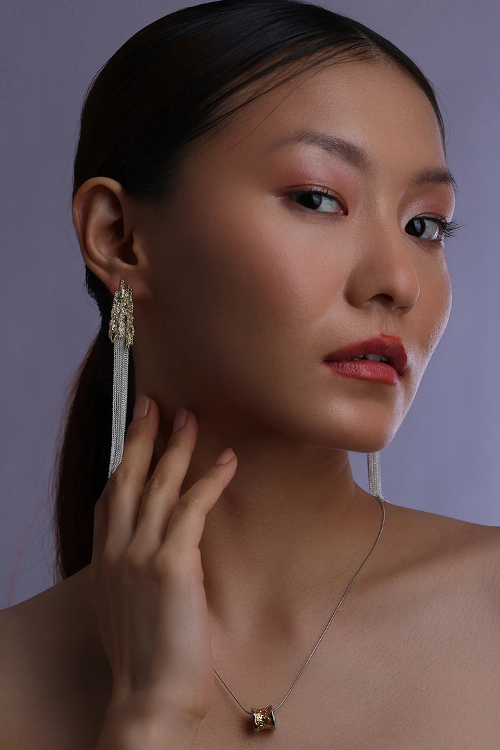 Molten cascade drop earrings with textured gold top and long chain tassels