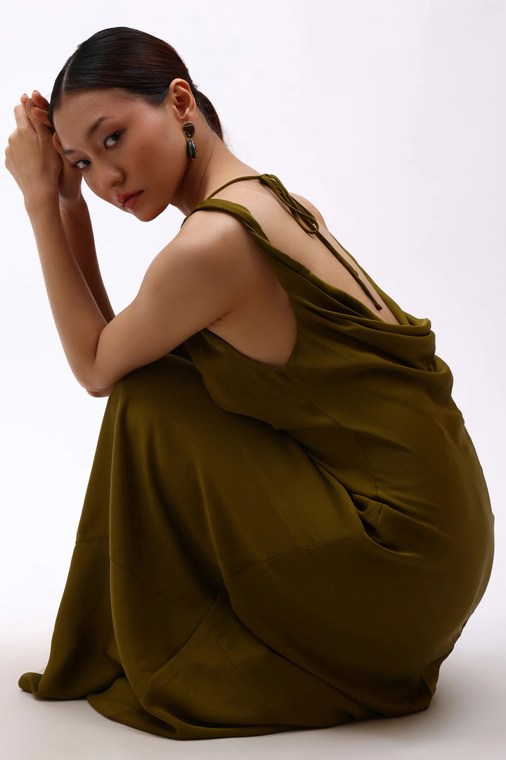 Model wearing Min & Lith Patina Drop Earrings, showcasing the turquoise-green textured drops and polished gold-toned oval tops.