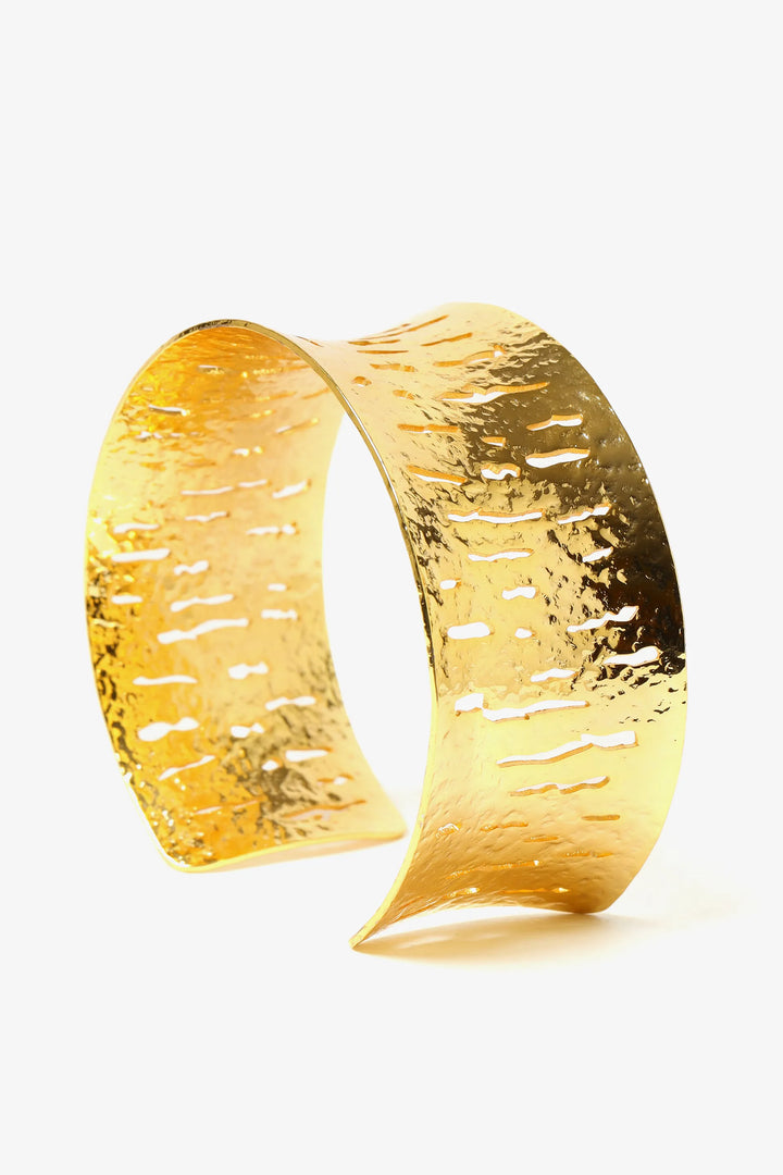 Textured relief cuff bracelet in gold with sculptural open form