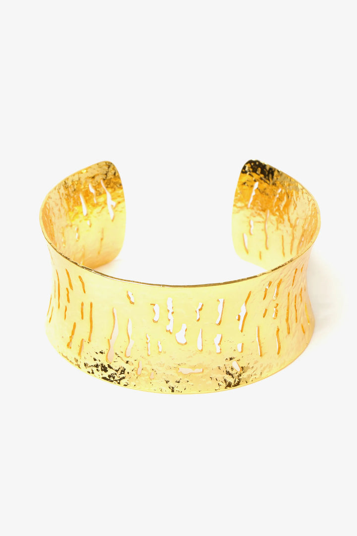 Textured relief cuff bracelet in gold with sculptural open form